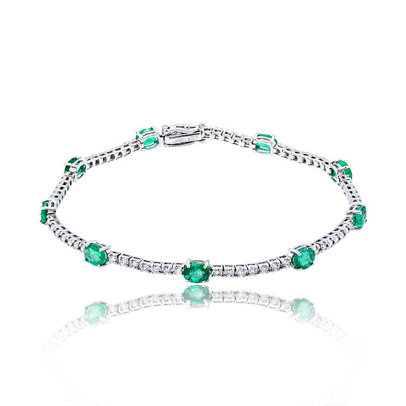 Riviere Bracelet with oval Emeralds and Diamonds